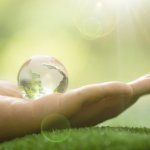 Close up of Green Planet in Your Hands. Save Earth. Environment