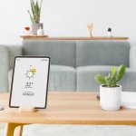 Digital tablet screen with smart home controller on a wooden tab